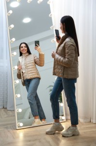 Woman in front of mirror